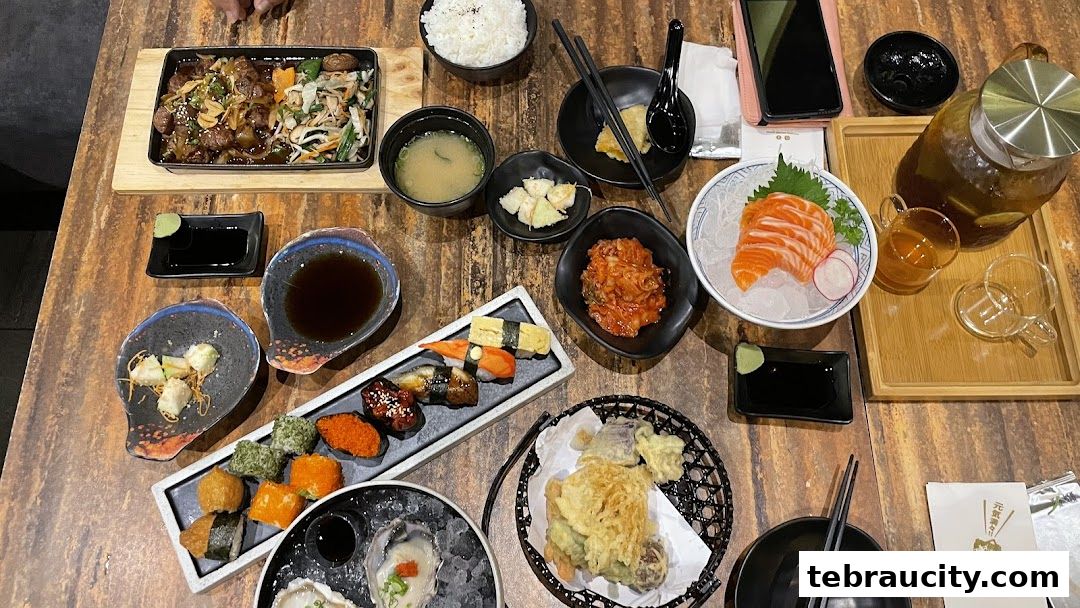 A spread of delicious Japanese dishes including sushi, sashimi, tempura, and more.