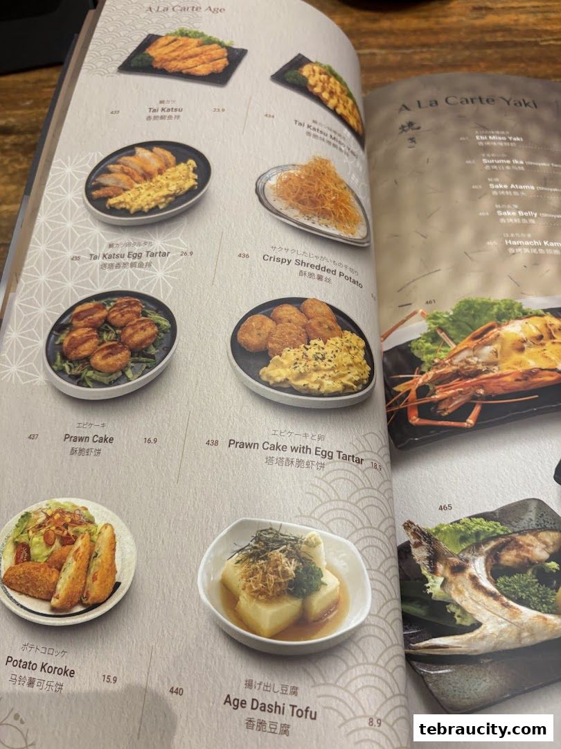 A menu from Kinsahi Japanese Restaurant featuring various Japanese dishes with images and prices.