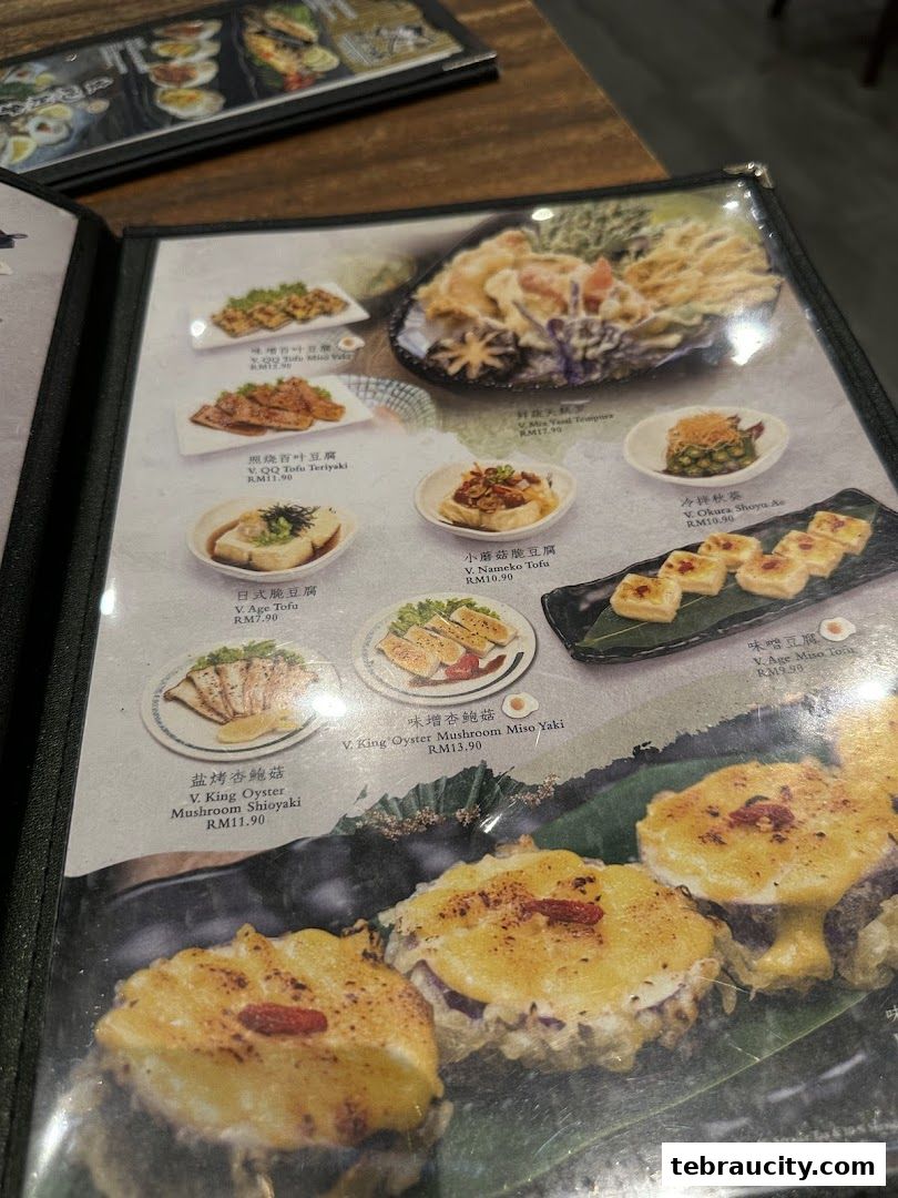 A menu from Kinsahi Japanese Restaurant showcasing various tofu and mushroom dishes with prices.