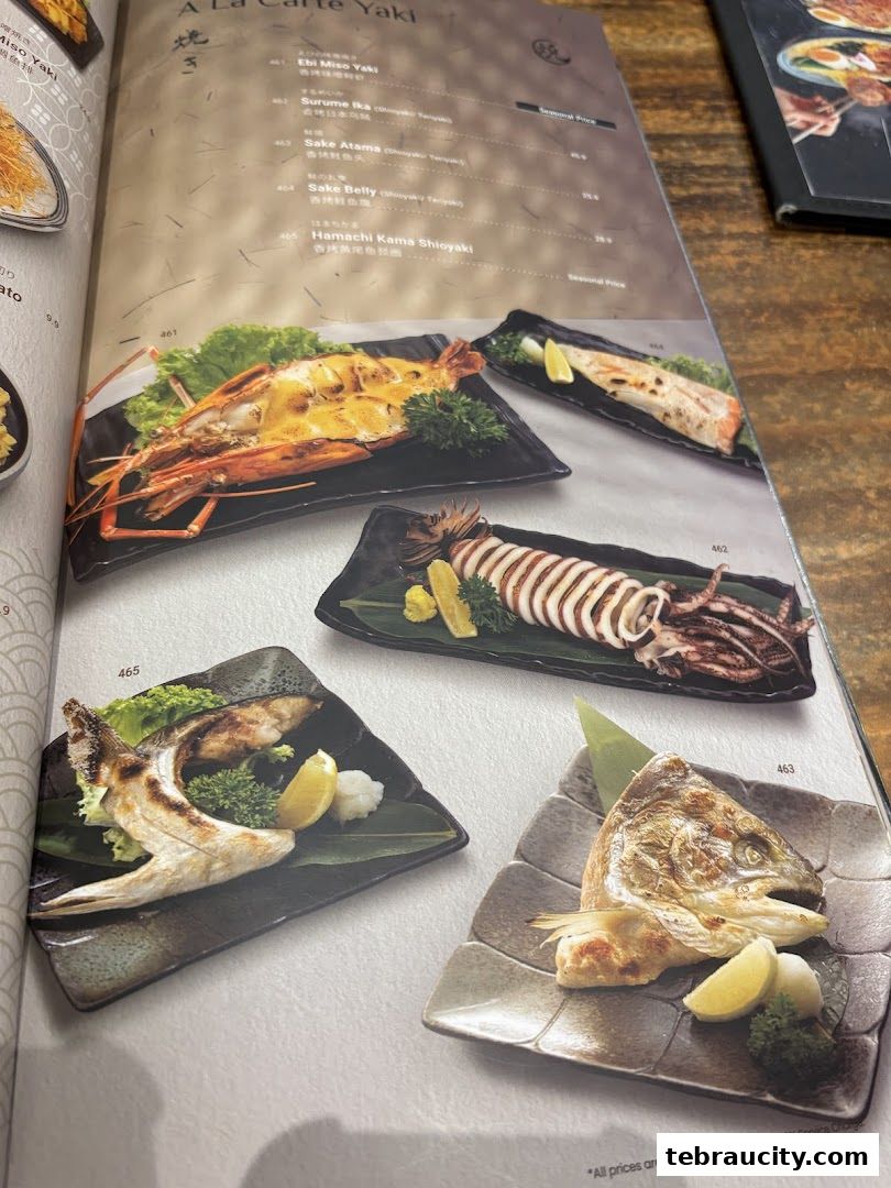A menu page from Kinsahi Japanese Restaurant featuring grilled seafood dishes.