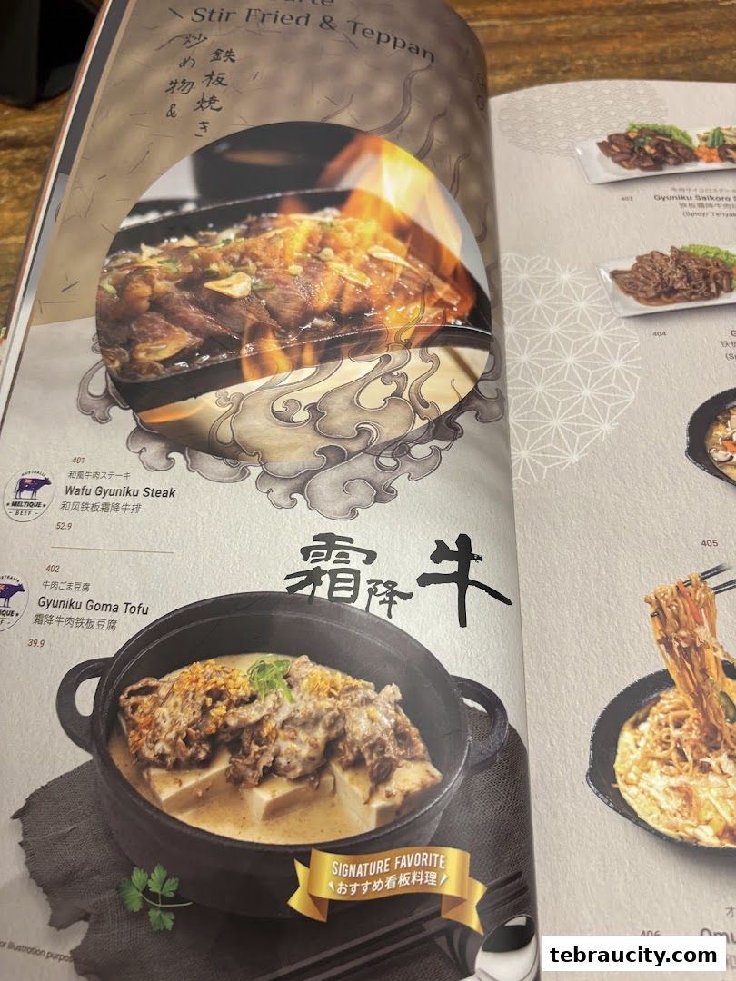 A menu page from Kinsahi Japanese Restaurant featuring stir-fried and teppan dishes.