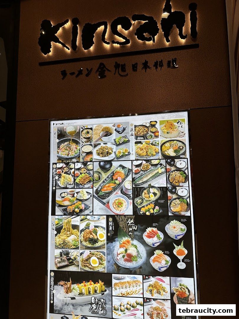 A brightly lit menu board showcasing various Japanese dishes, including sushi, ramen, and sashimi.