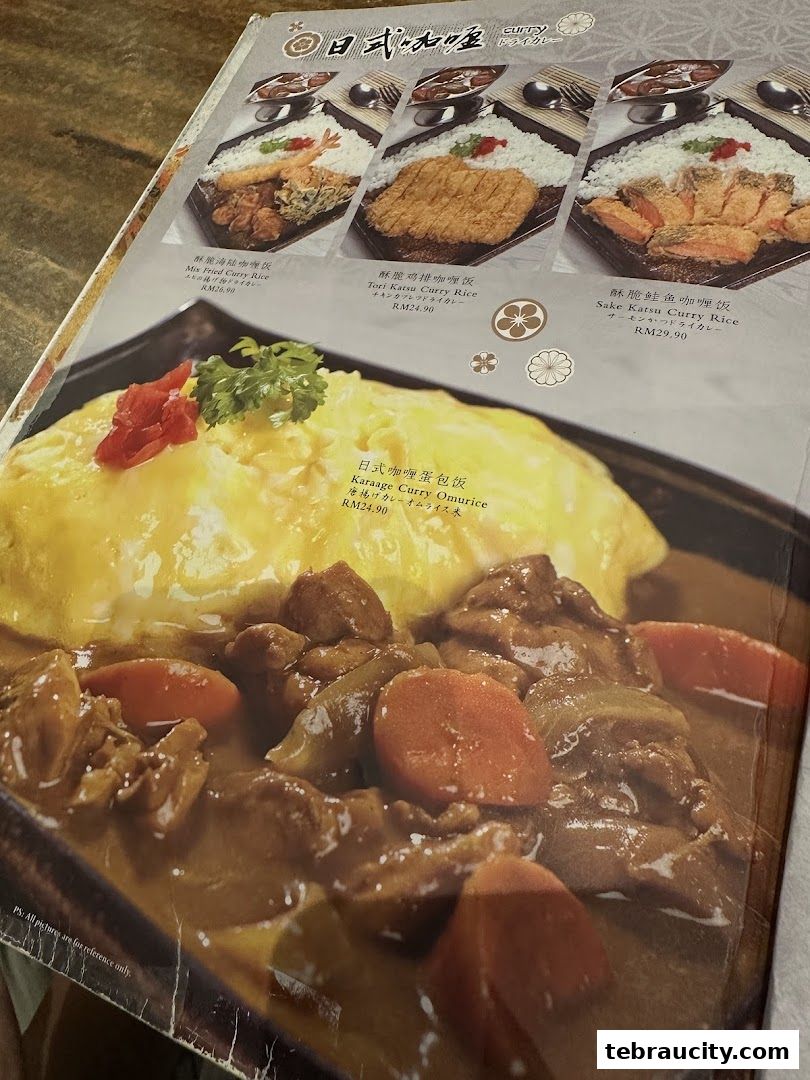 A menu from Kinsahi Japanese Restaurant featuring various curry rice dishes and an omurice.