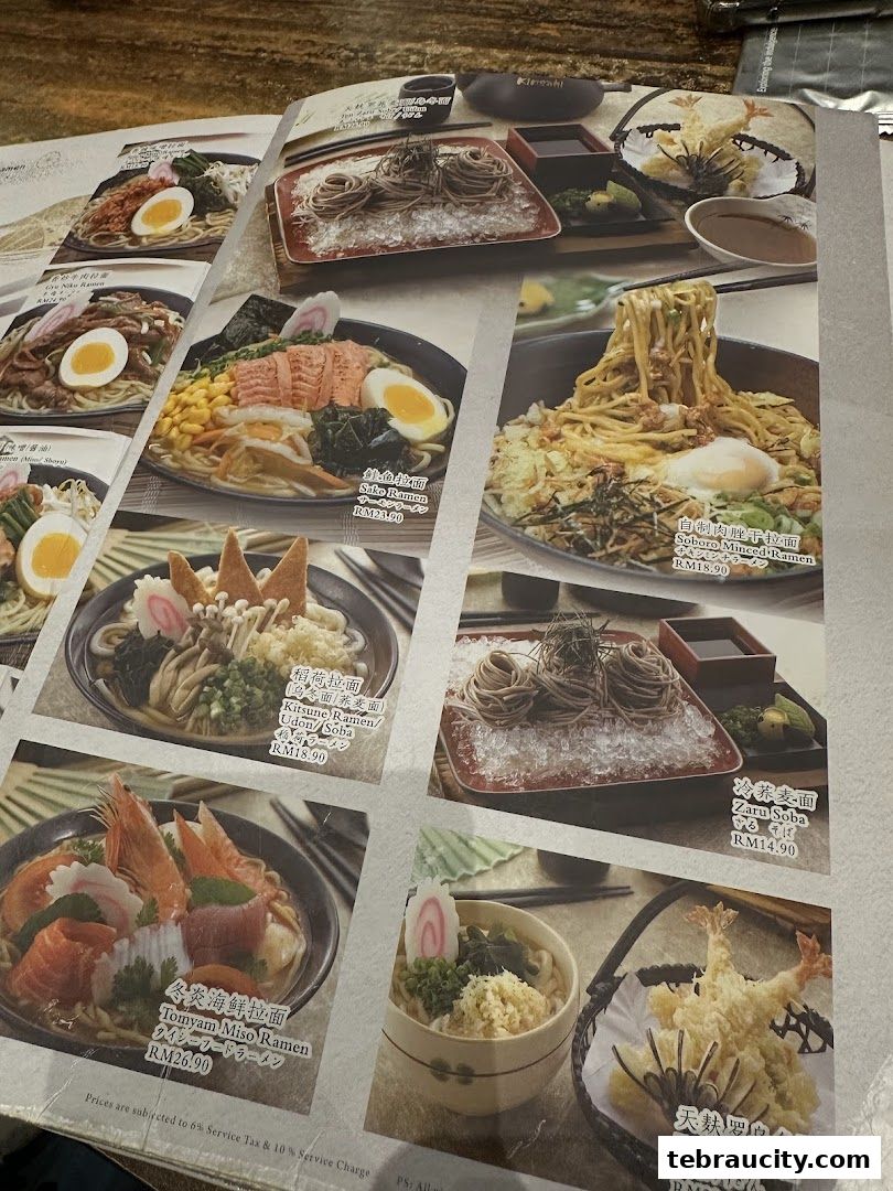 A menu from Kinsahi Japanese Restaurant showcasing various ramen and udon dishes with prices.