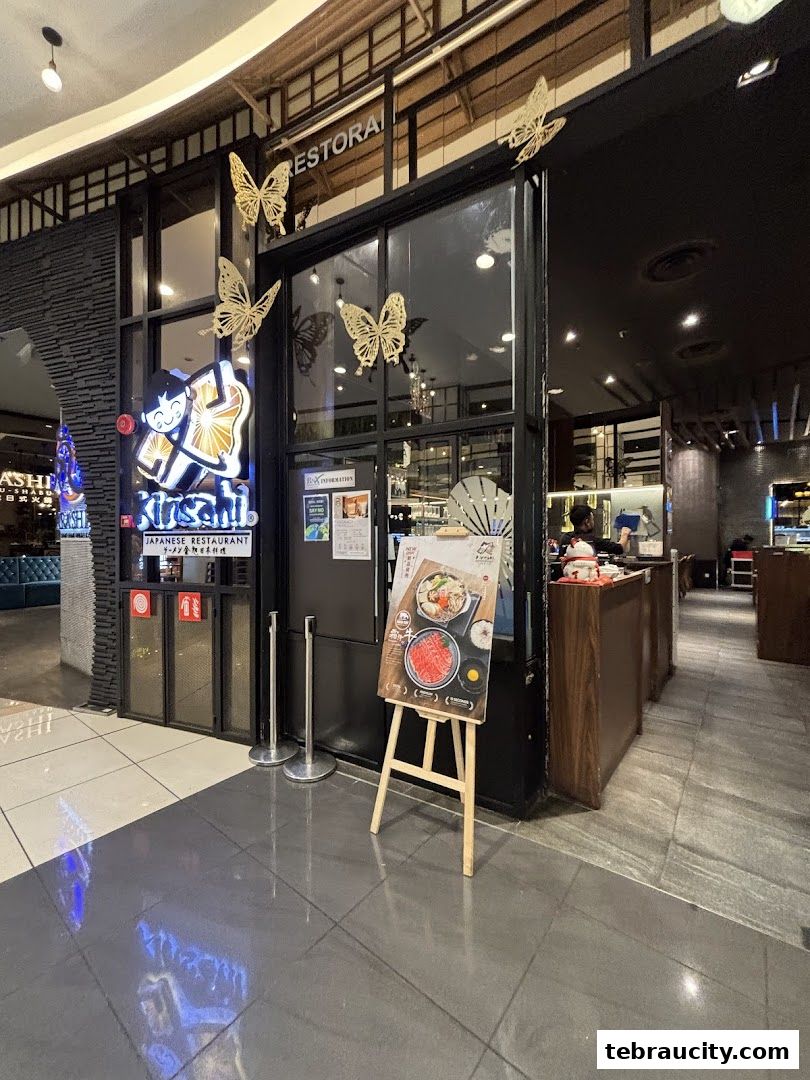 Kinsahi Japanese Restaurant storefront with a promotional display and decorative butterflies.