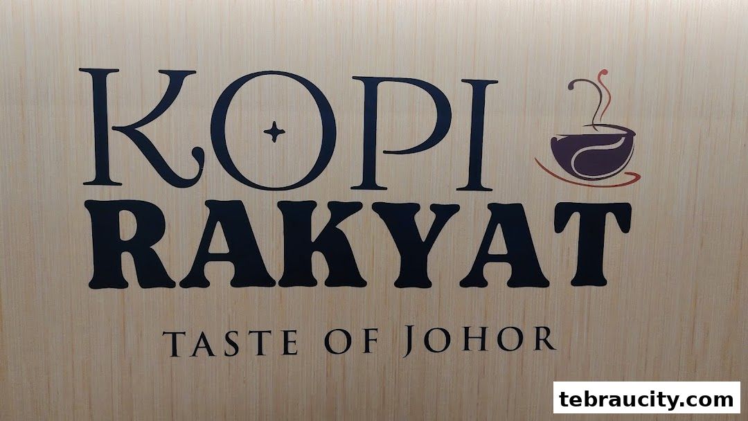 The Kopi Rakyat logo with a coffee cup icon and 'Taste of Johor' tagline.