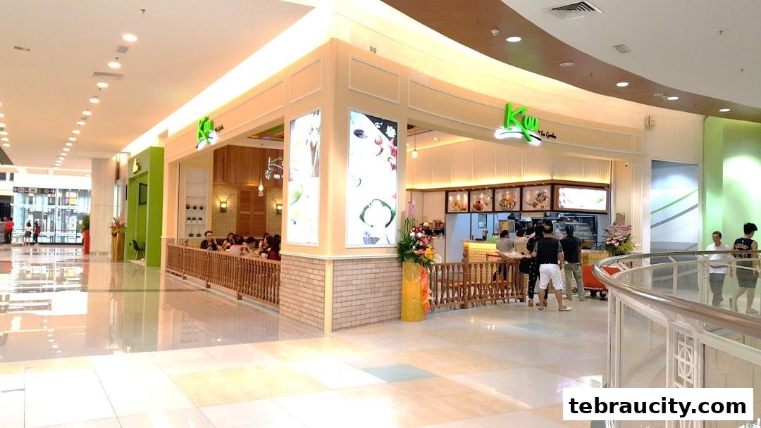 A bright and inviting tea shop with customers seated and staff serving.
