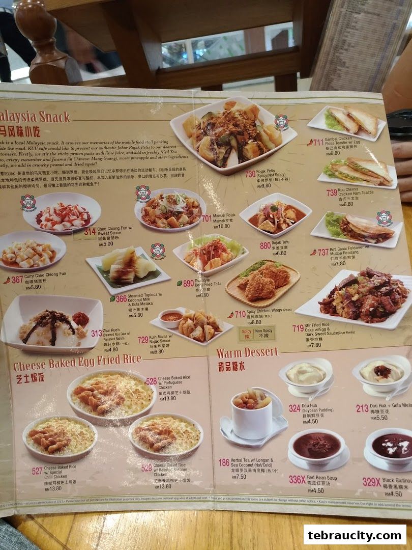 A menu featuring Malaysian snacks and warm desserts with prices and descriptions.