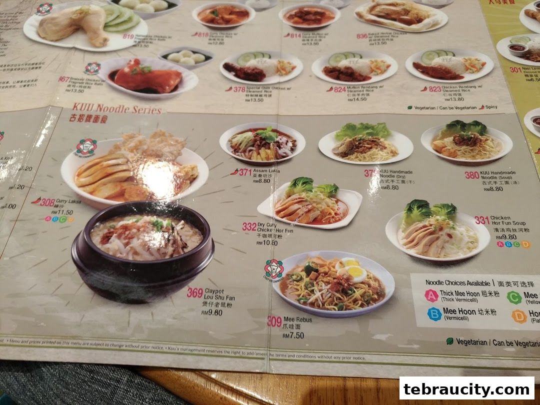 A menu from Kuu By Tea Garden featuring various noodle dishes and other Malaysian cuisine.