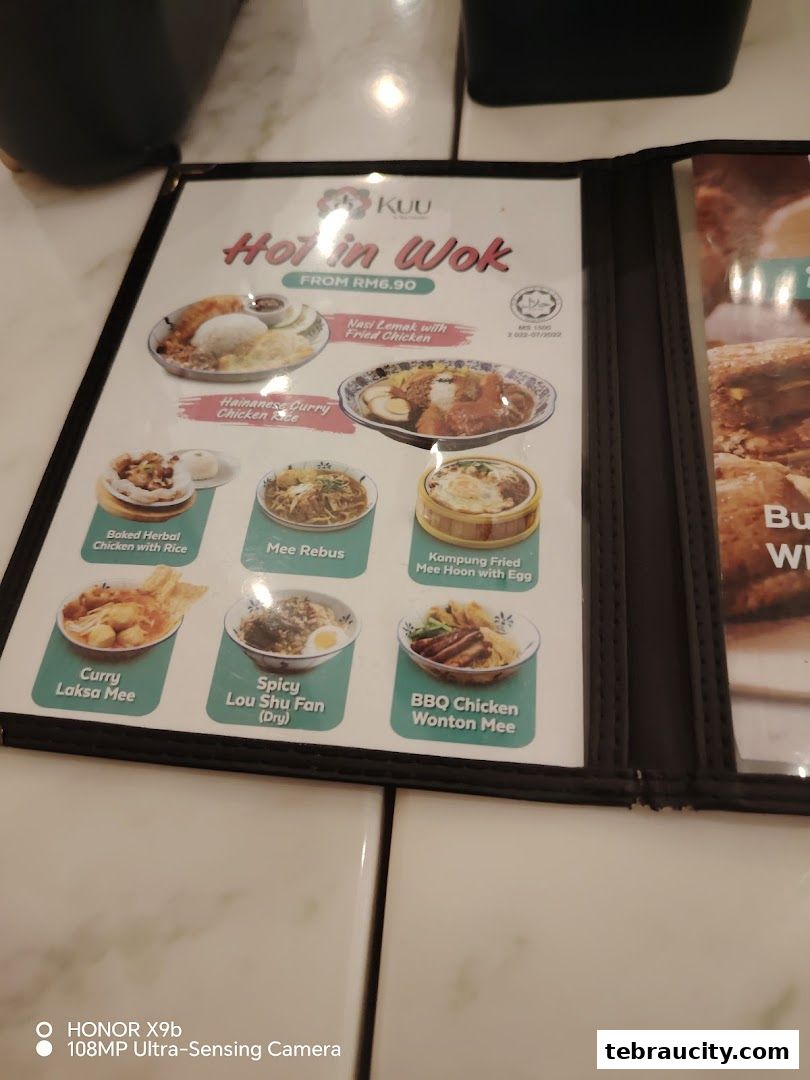 A menu from Kuu By Tea Garden featuring various 'Hot in Wok' dishes.