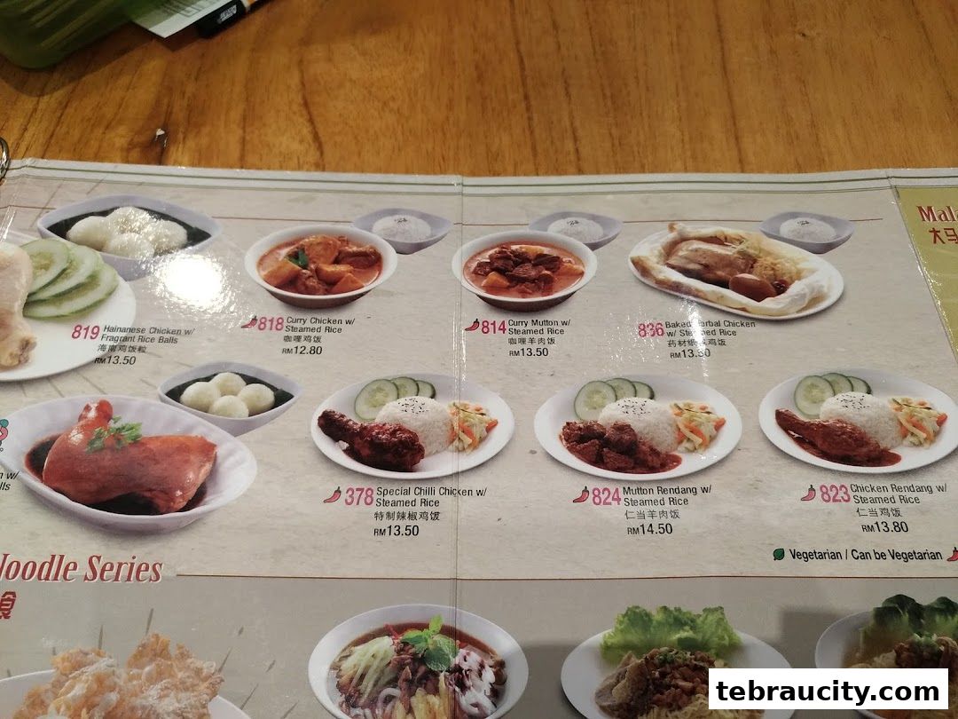 A menu from Kuu By Tea Garden Aeon Tebrau City showcasing various chicken and mutton dishes with rice.