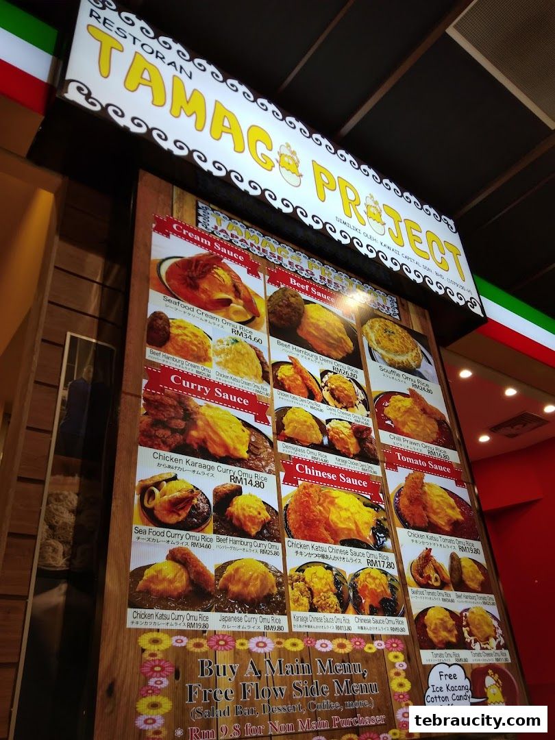 A menu board for Tamag Project restaurant featuring various Omu Rice dishes with different sauces.