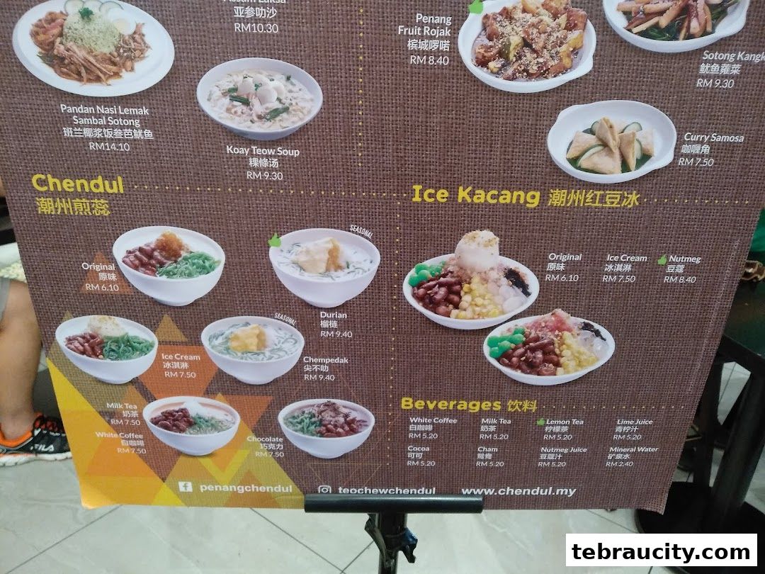 A menu board displaying various Malaysian dishes and beverages with prices.