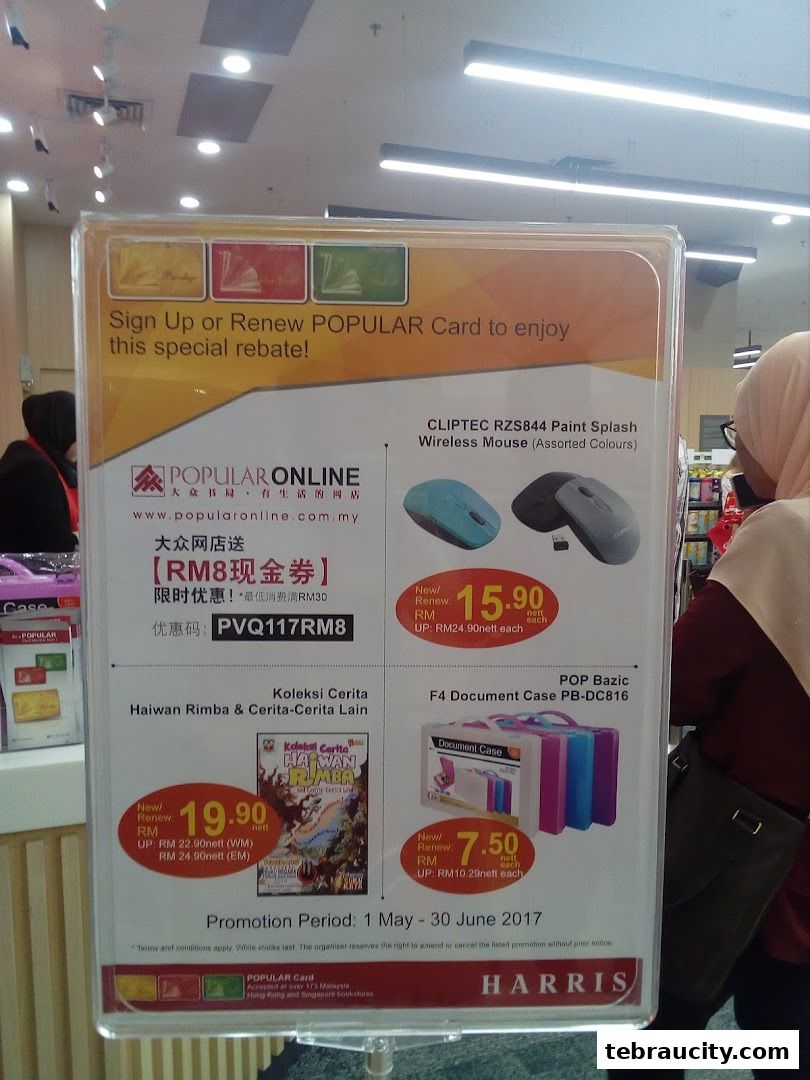 A promotional sign for Popular Card with offers on wireless mice and document cases.