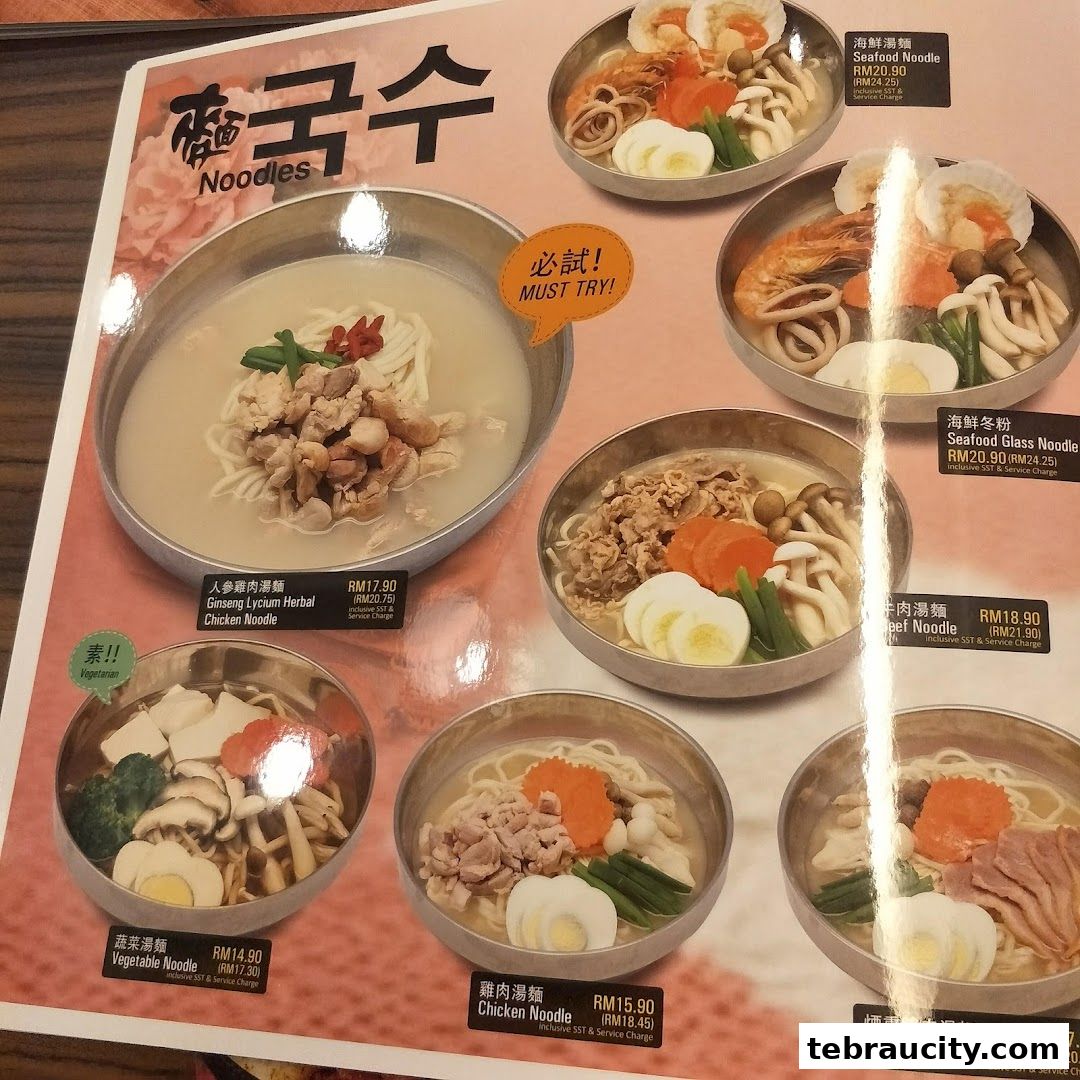 A menu featuring various Korean noodle dishes with appetizing images and prices.