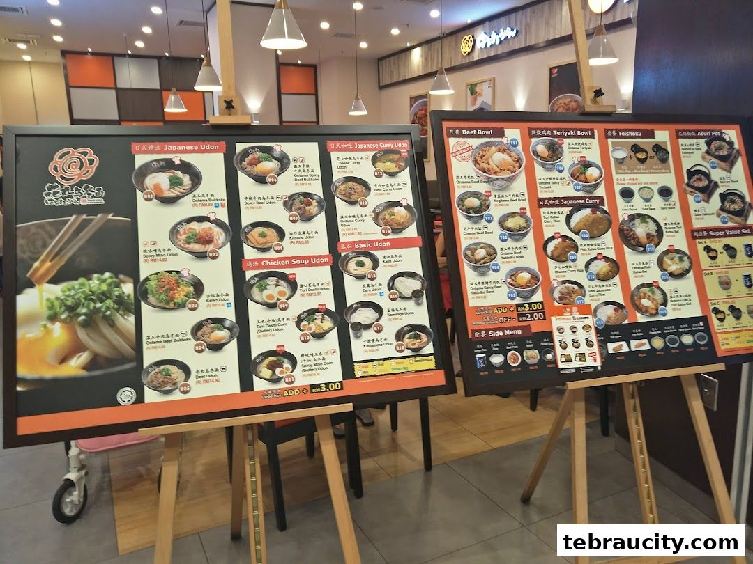A menu board displaying various Japanese dishes like Udon, Beef Bowls, and Curry.