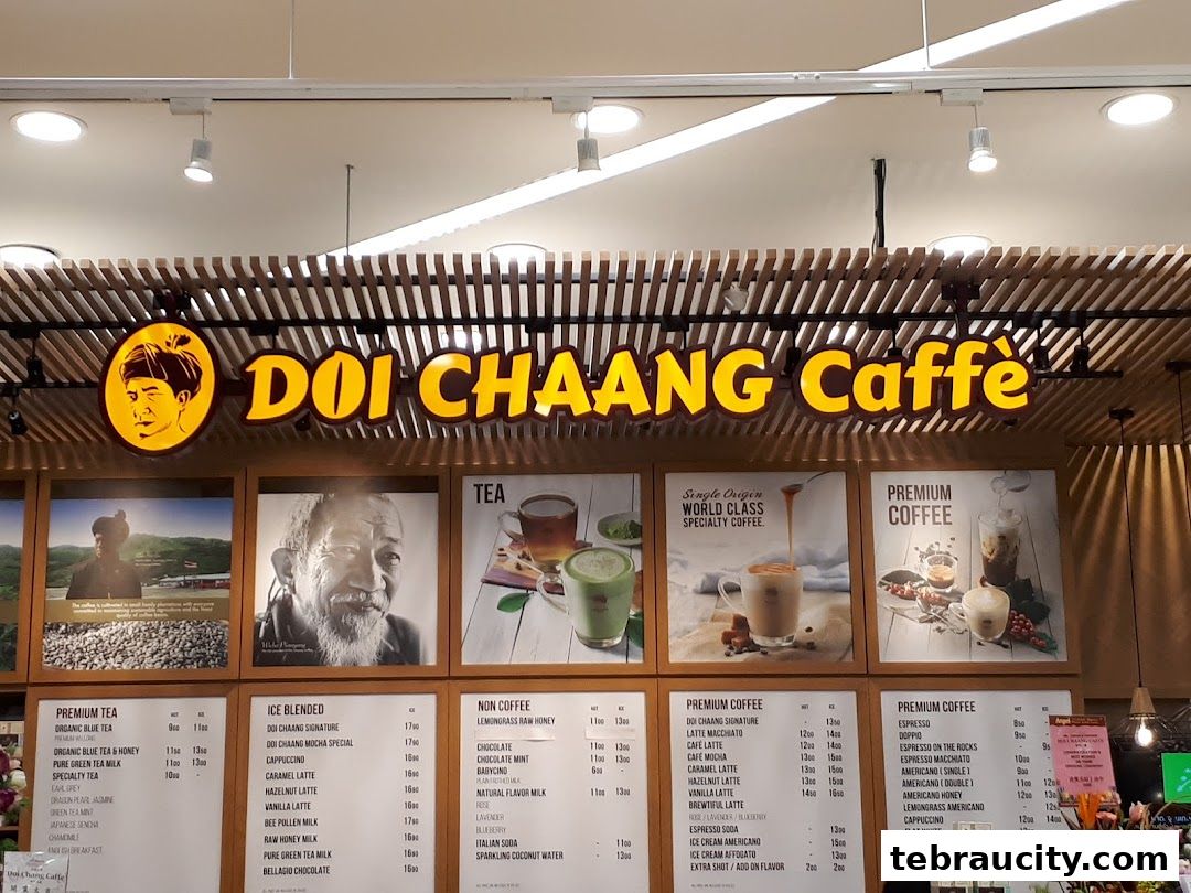 A Doi Chaang Caffe storefront with a menu board displaying teas and coffees.