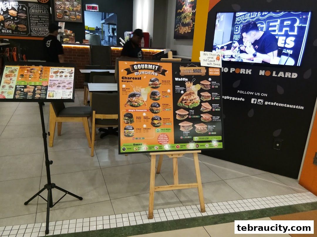 A display of menus for gourmet burgers and waffles at Lavender Bakery.