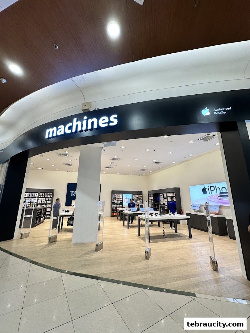 The entrance to the Machines Apple Reseller Store at AEON Tebrau City, showcasing Apple products.