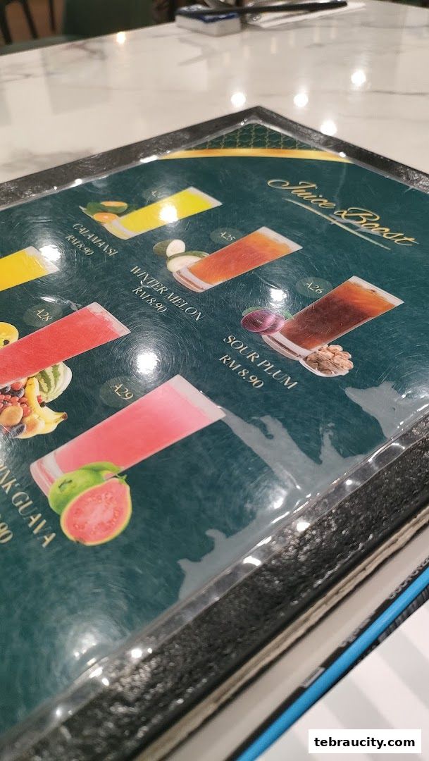 A menu featuring various juices with images and prices.