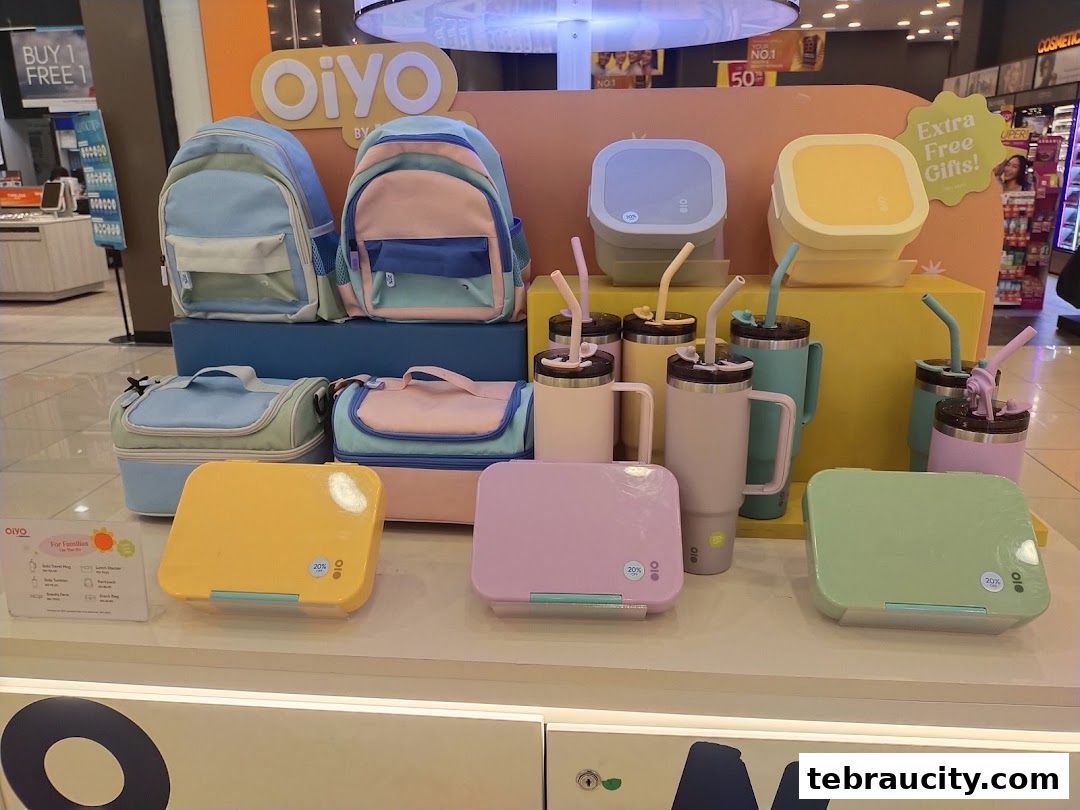 A display of colorful lunch boxes, backpacks, and tumblers from the brand OiYo.