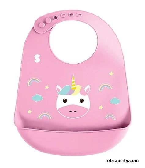 A pink baby bib with a unicorn design and rainbow accents.