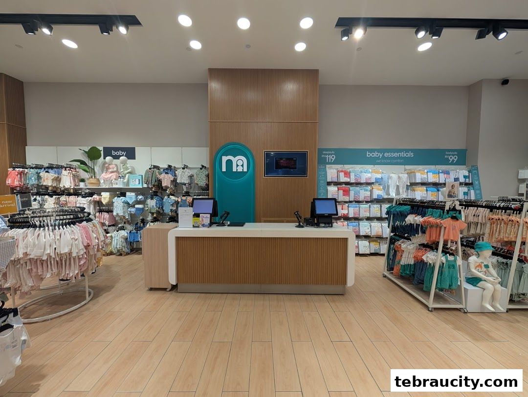 Interior view of a Mothercare shop showcasing baby clothing and essentials.