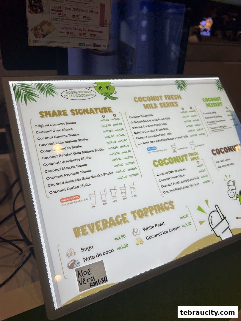 A brightly lit menu board displaying various coconut-based drinks and desserts.
