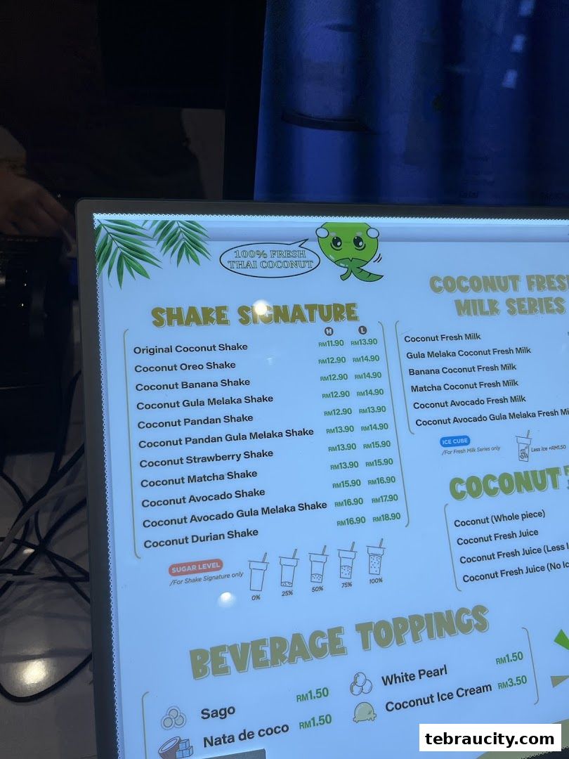 A menu displaying various coconut shakes, milk drinks, and beverage toppings with prices.