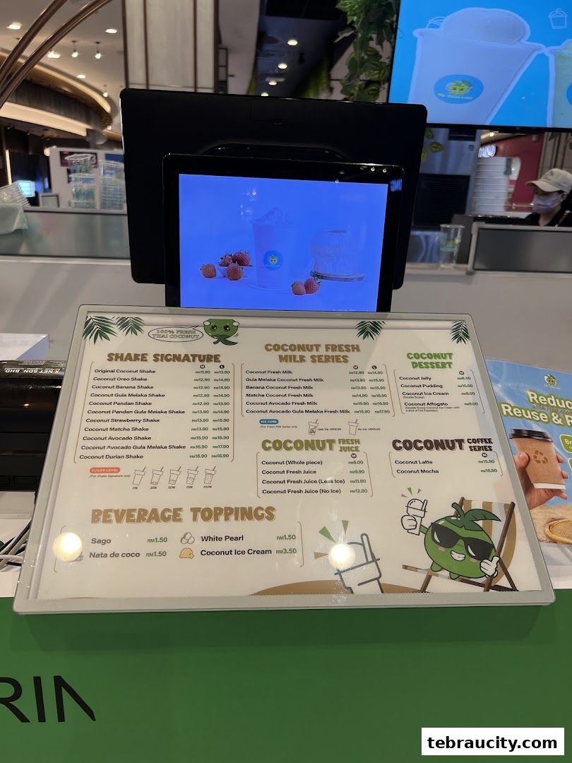 A menu for My Cocoanut Aeon Tebrau City featuring shakes, fresh milk drinks, desserts, and toppings.