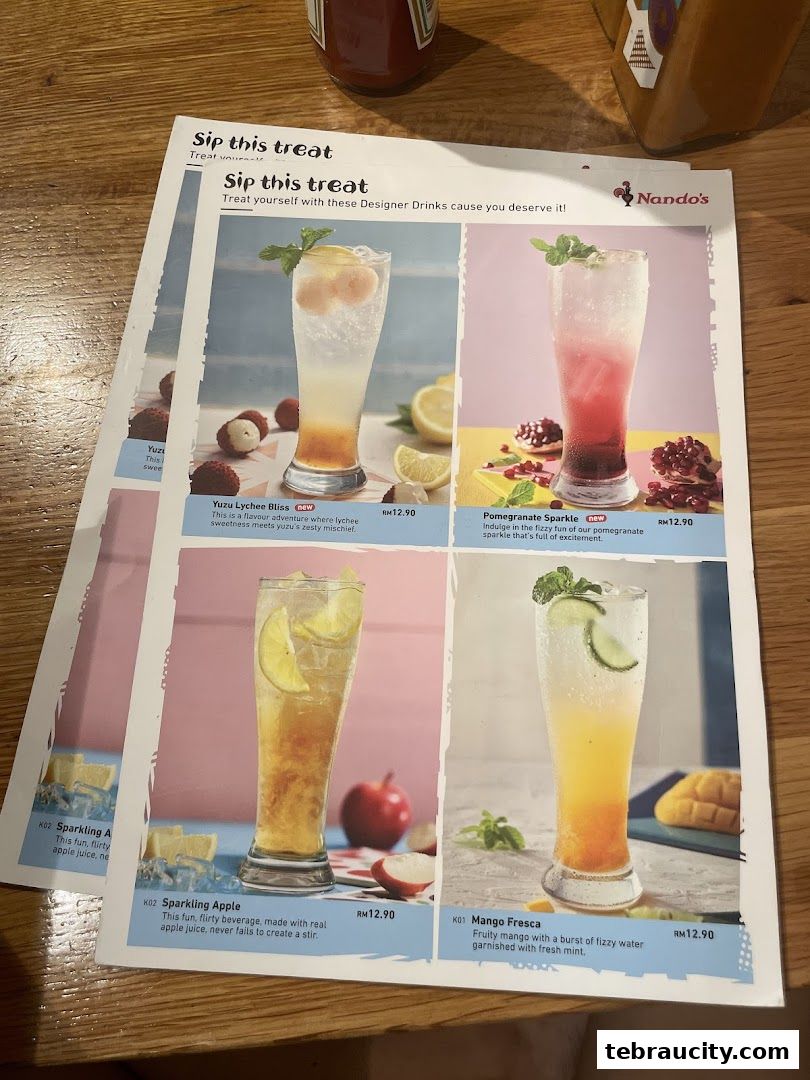 A menu featuring four designer drinks with vibrant images and descriptions.