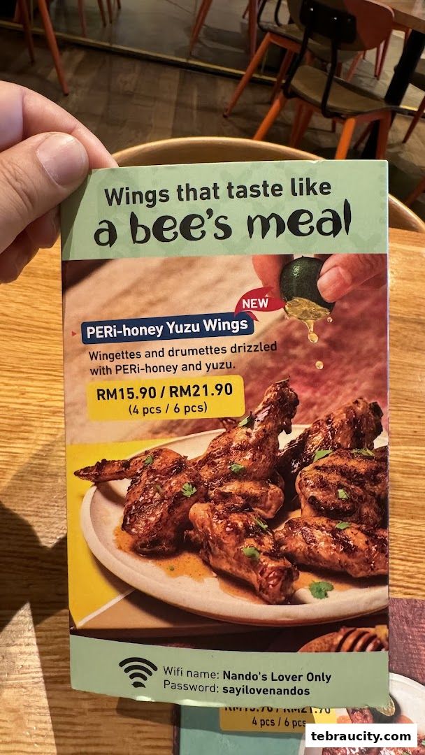 A menu flyer showcasing Peri-honey Yuzu Wings with prices and description.