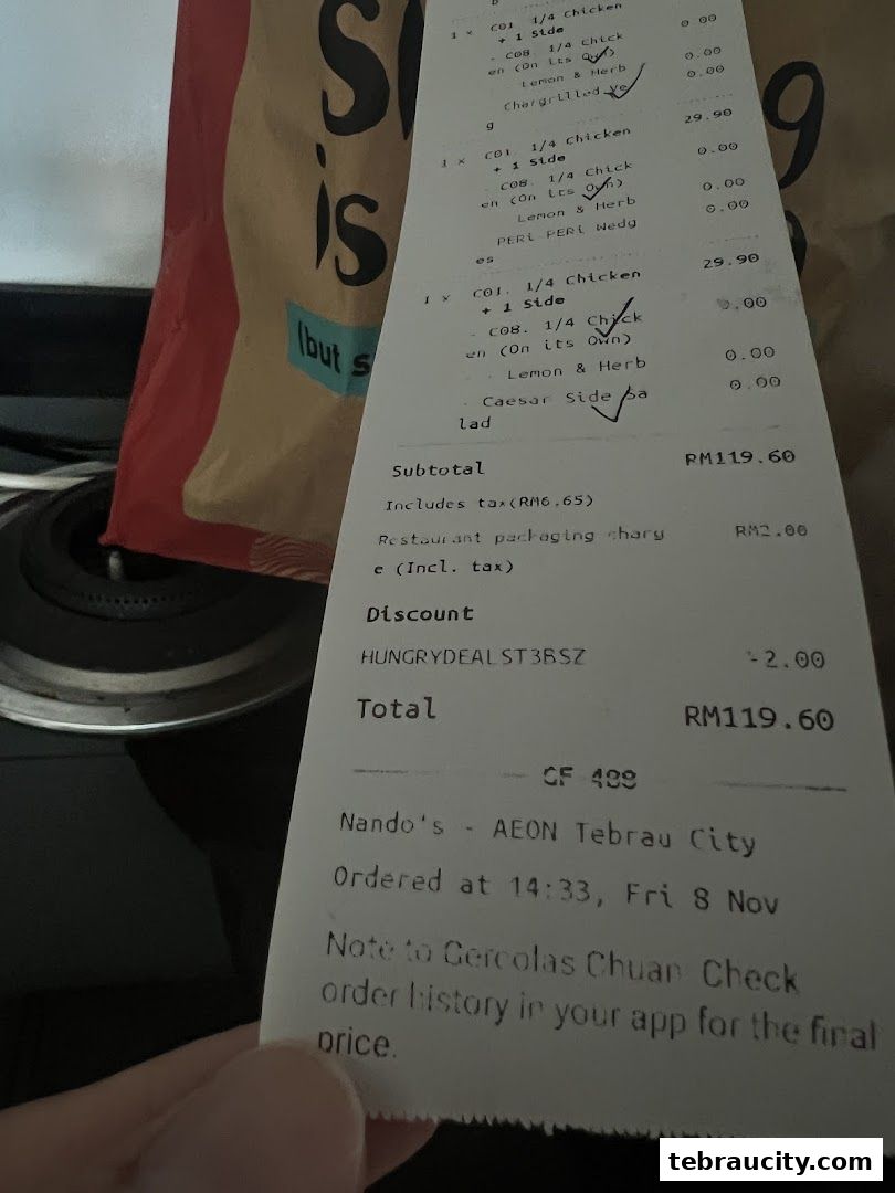 A receipt from Nando's AEON Tebrau City showing a meal order and total cost.
