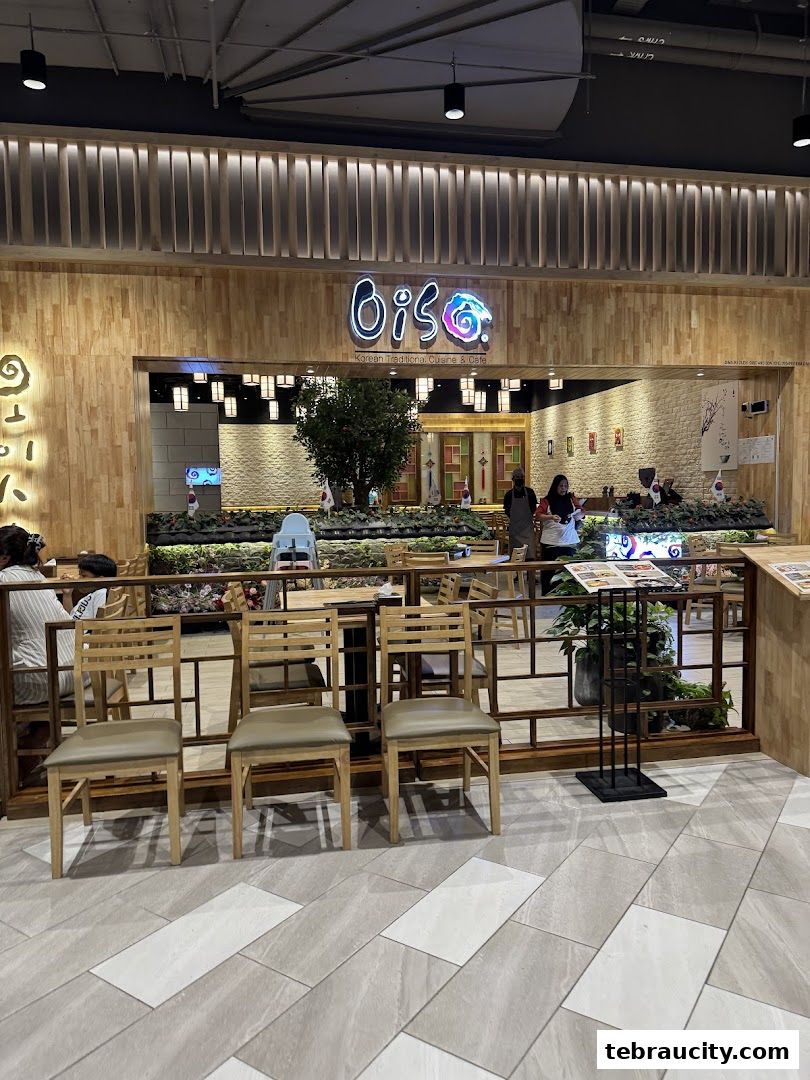 The exterior of Oiso Korean Restaurant with its prominent signage and inviting seating area.