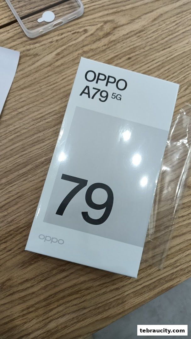 A box for the OPPO A79 5G smartphone is displayed on a wooden surface.