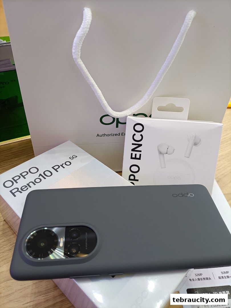 OPPO Reno10 Pro 5G phone, Enco earbuds, and shopping bag.