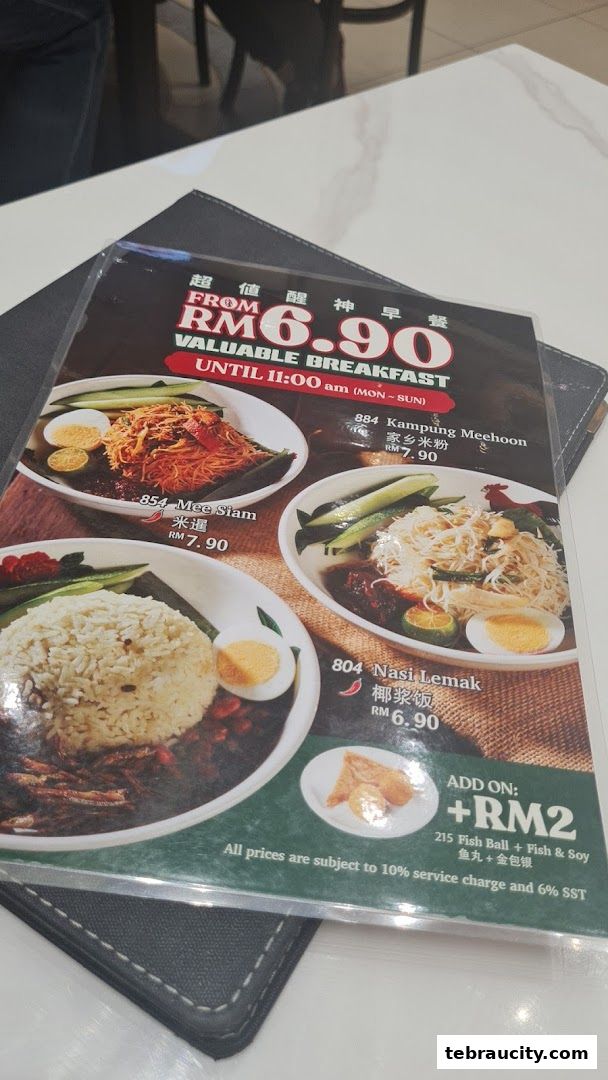 A menu from Oriental Kopi featuring breakfast dishes like Mee Siam, Kampung Meehoon, and Nasi Lemak.