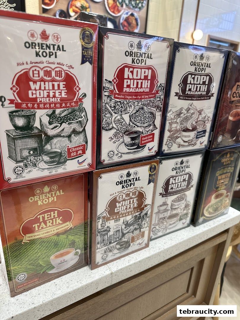 A display of Oriental Kopi products, including white coffee and teh tarik premixes.