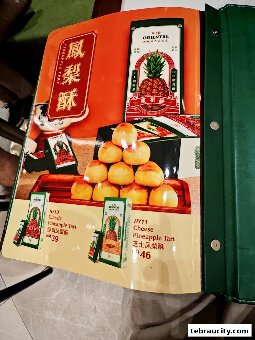 A menu page showcasing Oriental Kopi's classic and cheese pineapple tarts with prices.