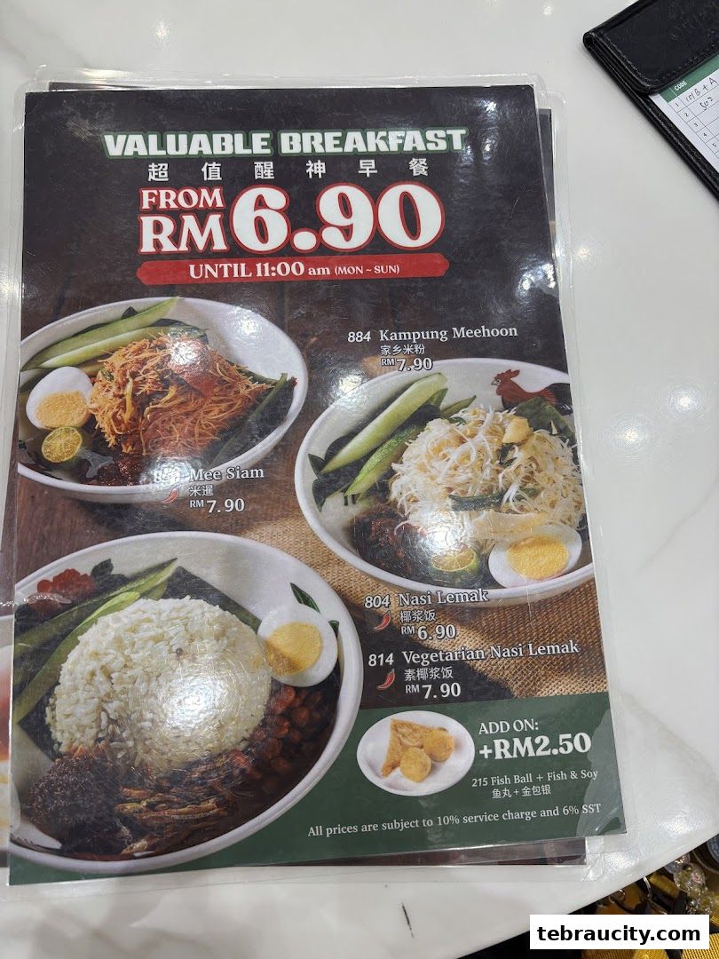 A menu featuring breakfast dishes like Nasi Lemak and Mee Siam, with prices and descriptions.