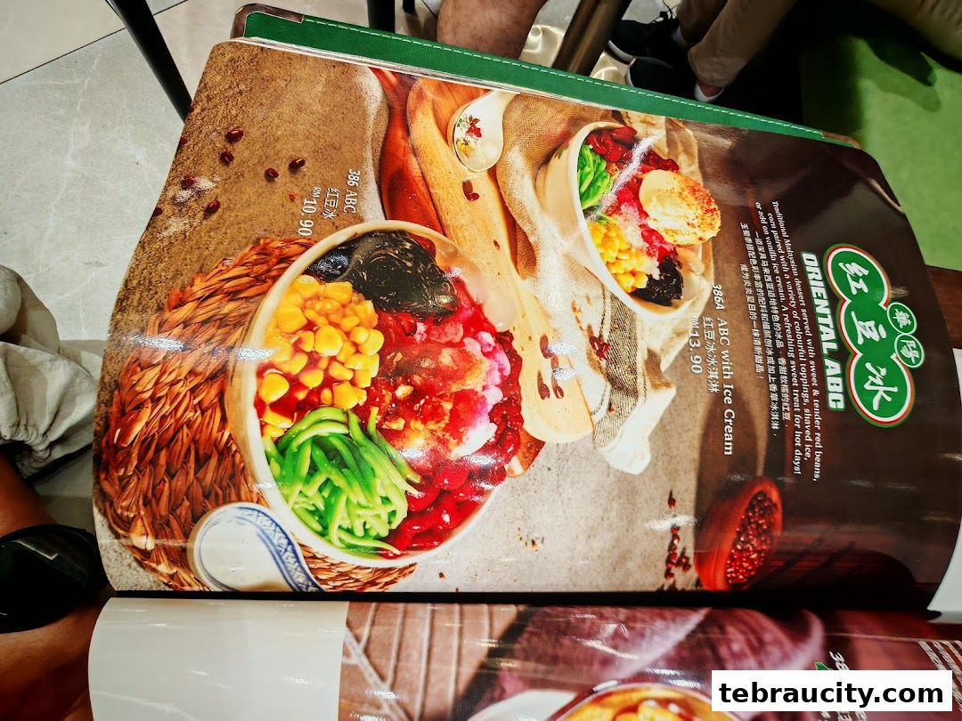 A menu from Oriental Kopi featuring a colorful dessert with ice cream and toppings.