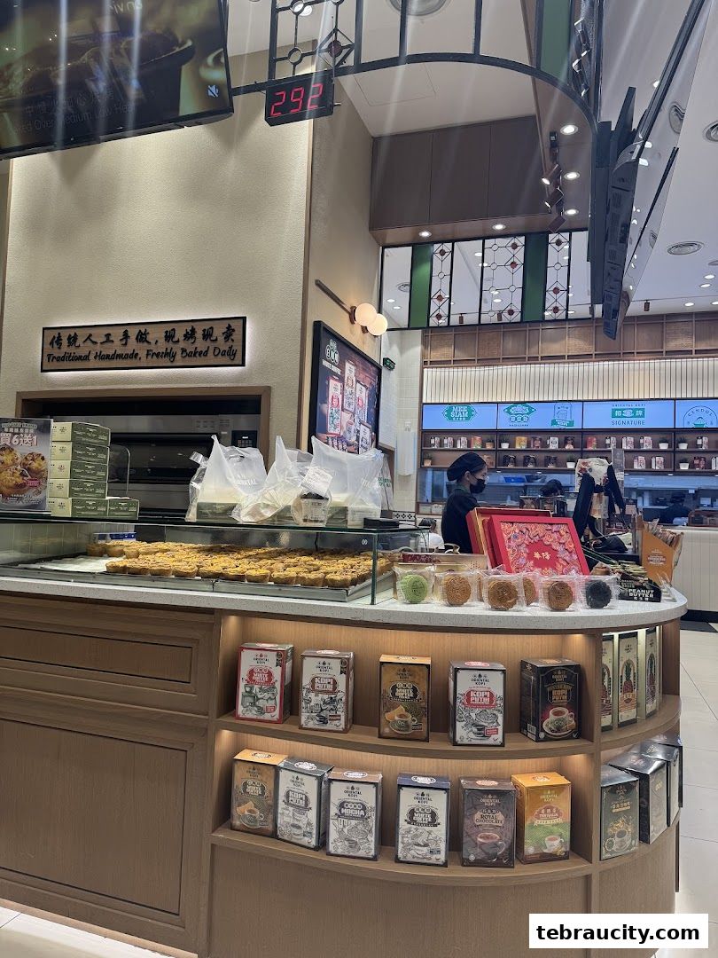 A display of baked goods and packaged coffee products at Oriental Kopi.