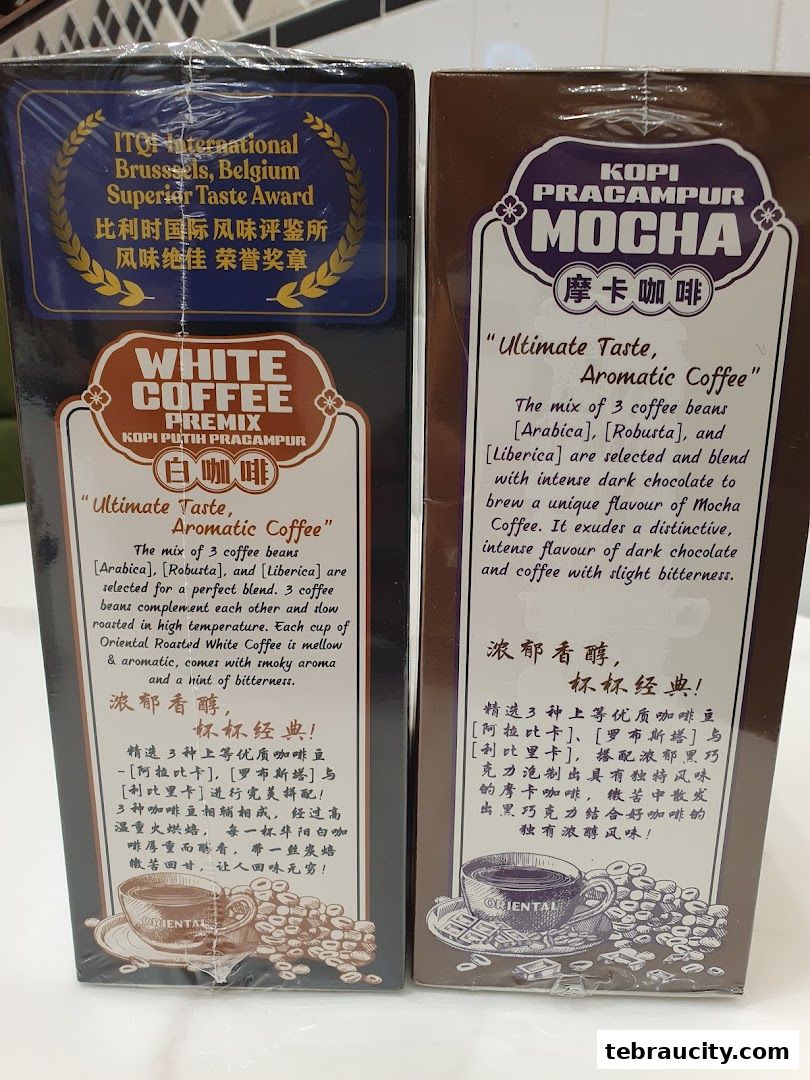 Two boxes of Oriental Kopi coffee premix, one White Coffee and one Mocha.