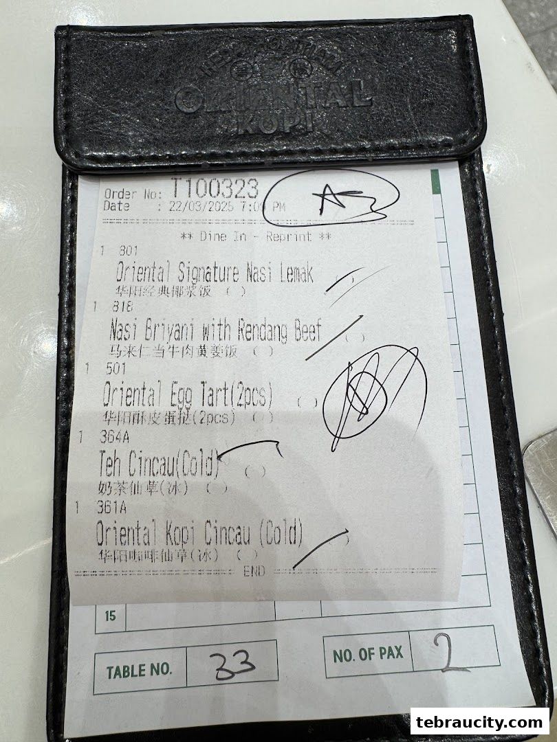 A receipt from Oriental Kopi showing a list of food and drinks ordered.