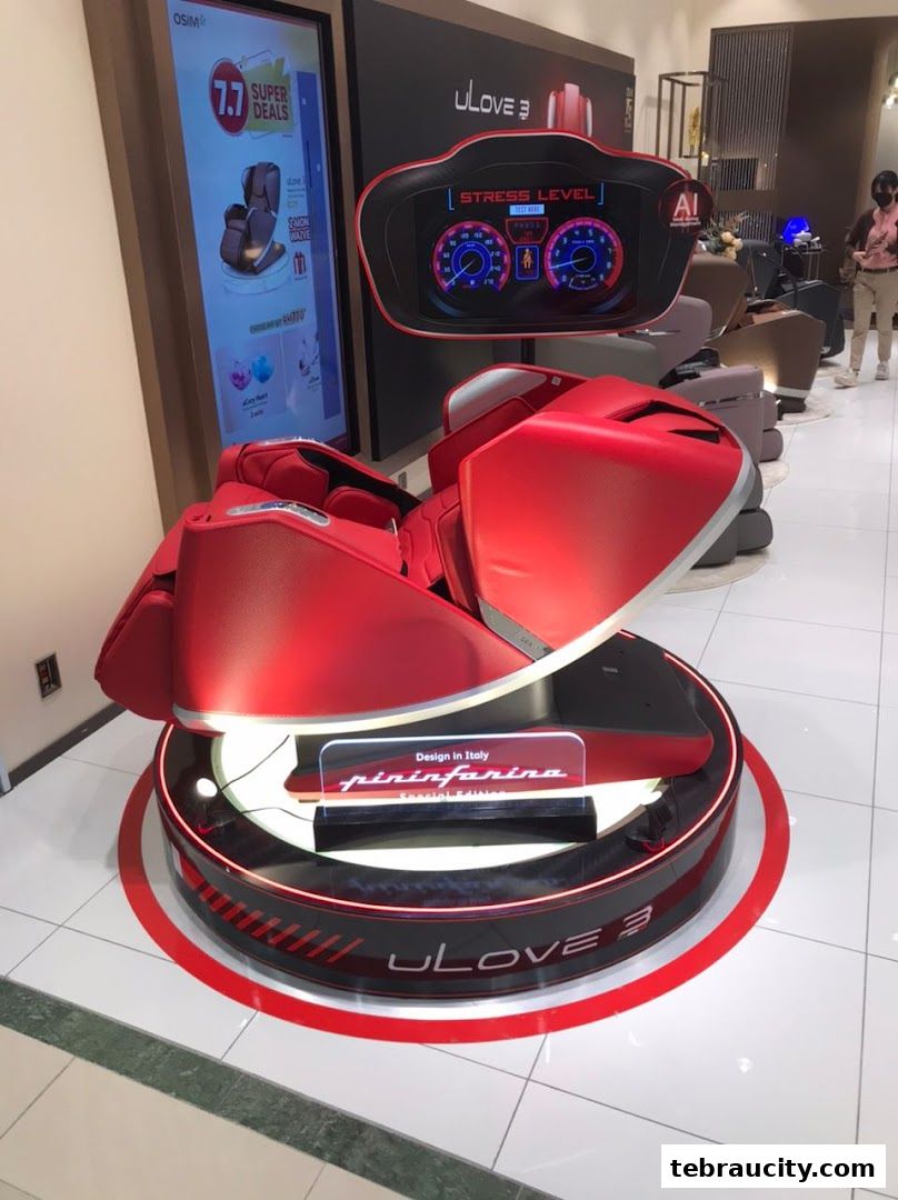 A red OSIM uLove 3 massage chair with a digital display showing stress levels.