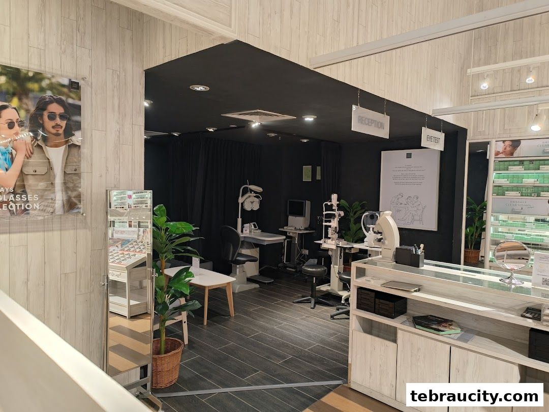 Interior view of an optical shop with eye examination equipment and eyewear displays.