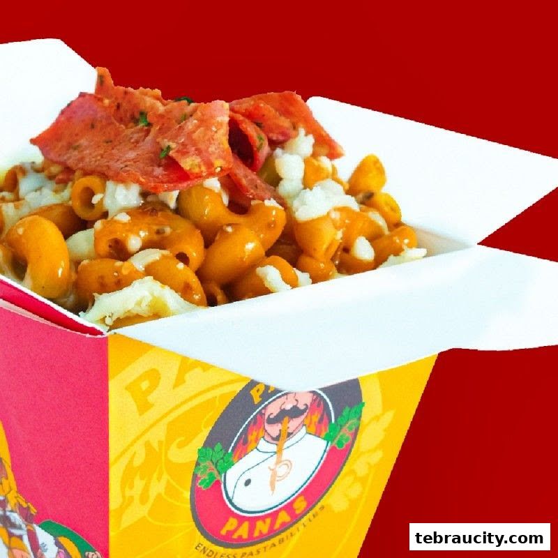 A close-up of a delicious pasta dish served in a branded takeaway box.