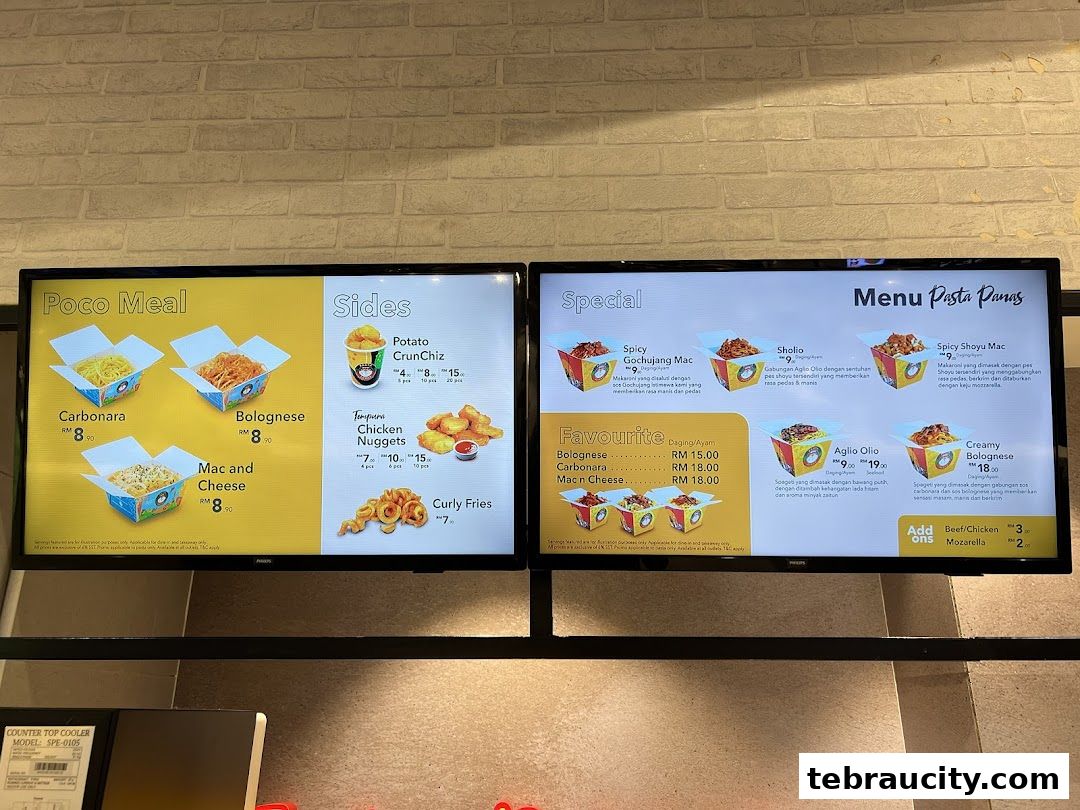 A digital menu board displaying various pasta dishes, sides, and meal deals from Pasta Panas.