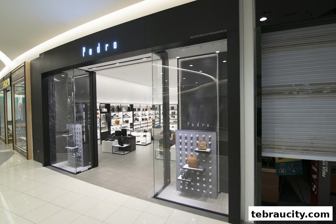 The Pedro store entrance showcases a modern display of bags and shoes, with a closed shutter to the right.