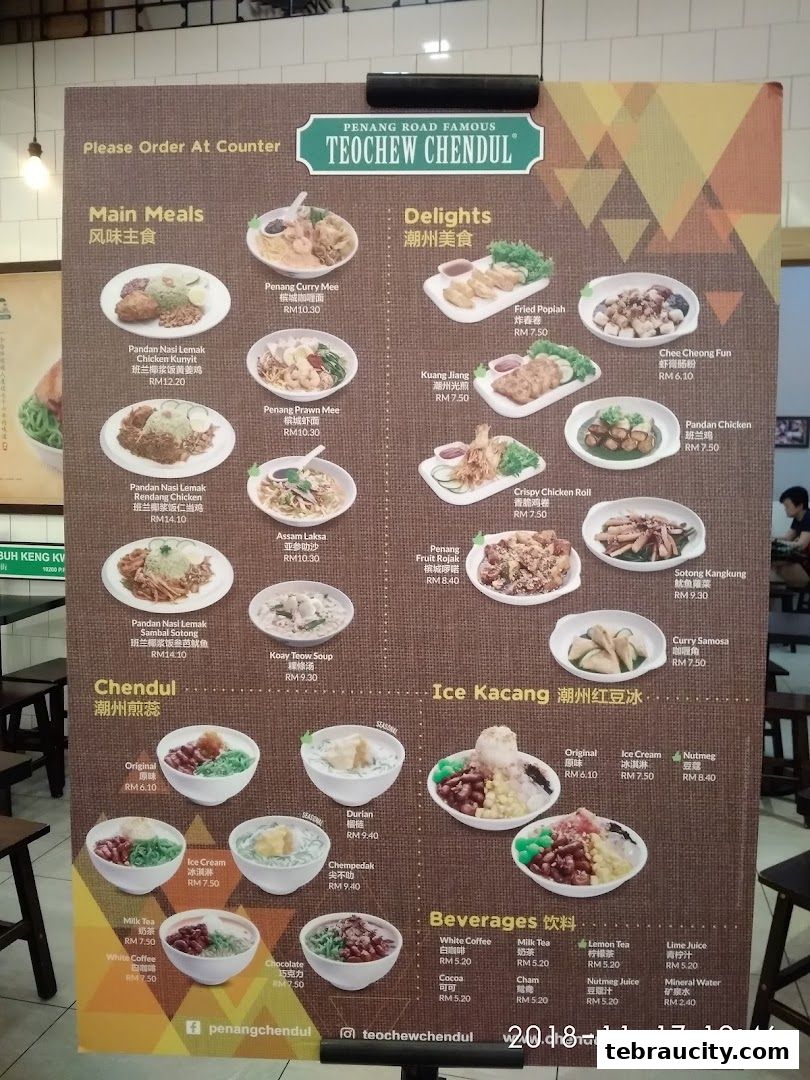 A menu board for Penang Road Famous Teochew Chendul, showcasing various dishes and beverages with prices.